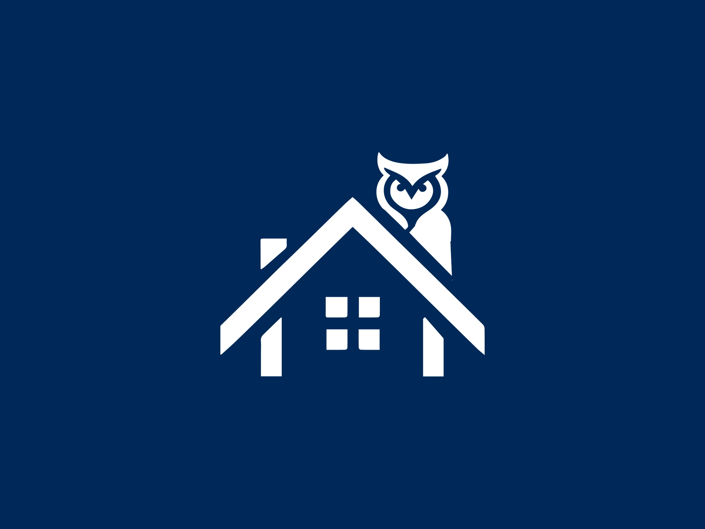 The emblem, an owl on the roof of a house, in white on navy