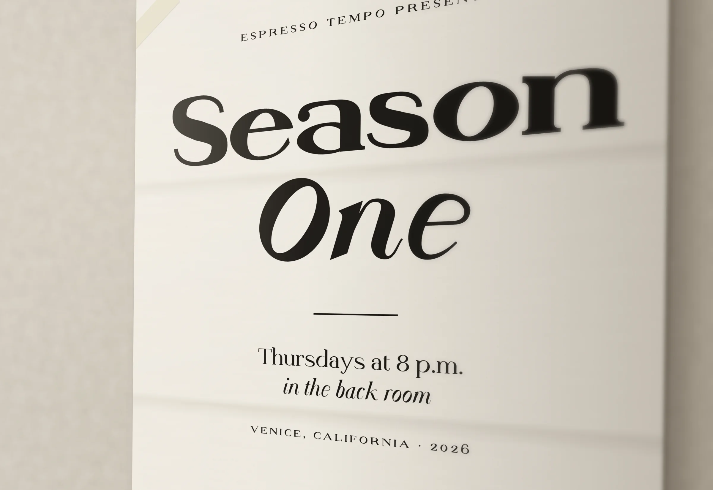 A poster on a plaster wall: Season One in Display Black and Bold Italic, the details in small caps.